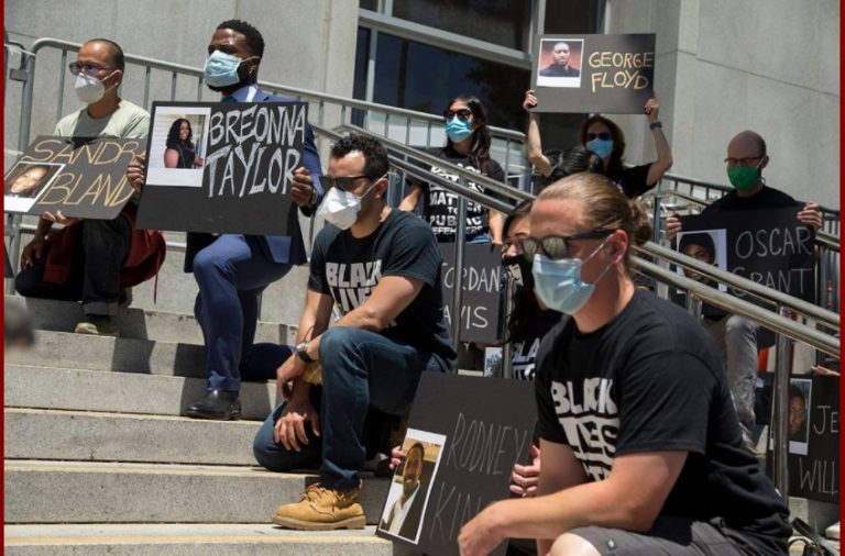 Public defenders kneel and take part in nationwide call for racial justice